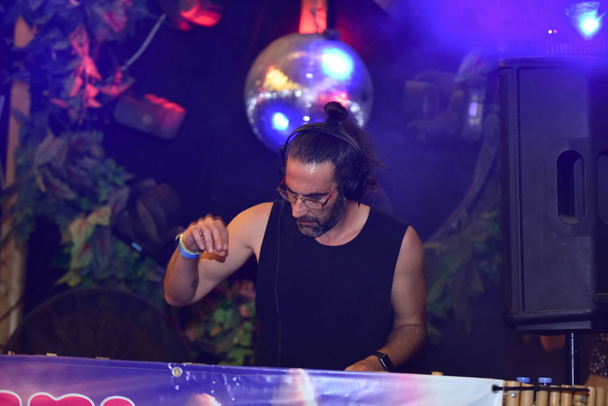 ARCHiiE at the decks, under a mirror ball