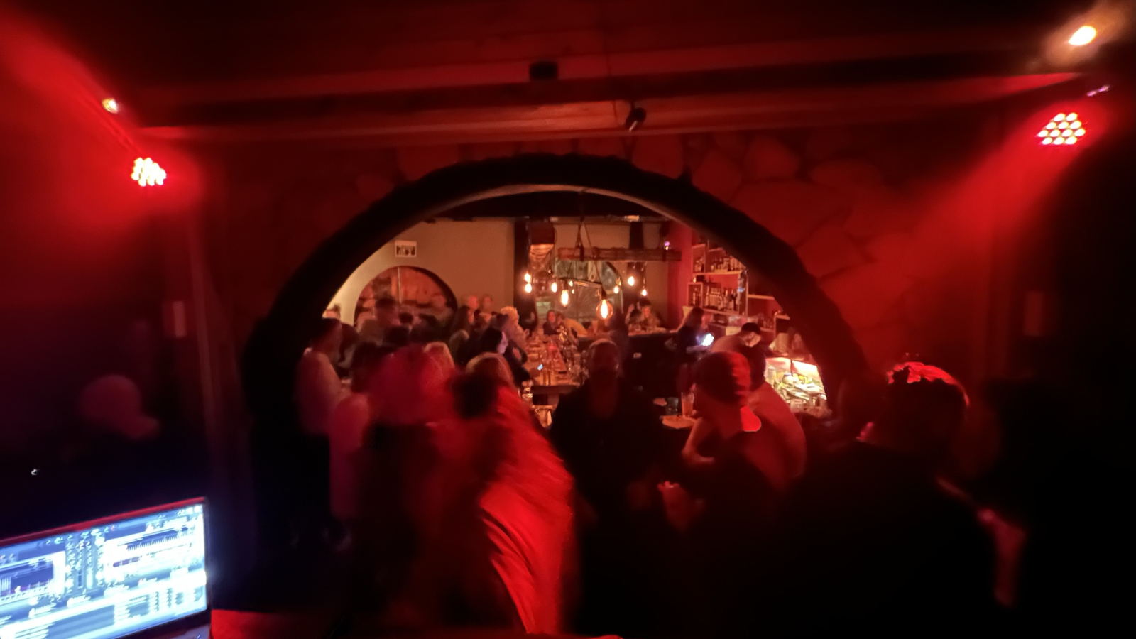 The view from the DJ booth at Archie’s Pub, through the arch